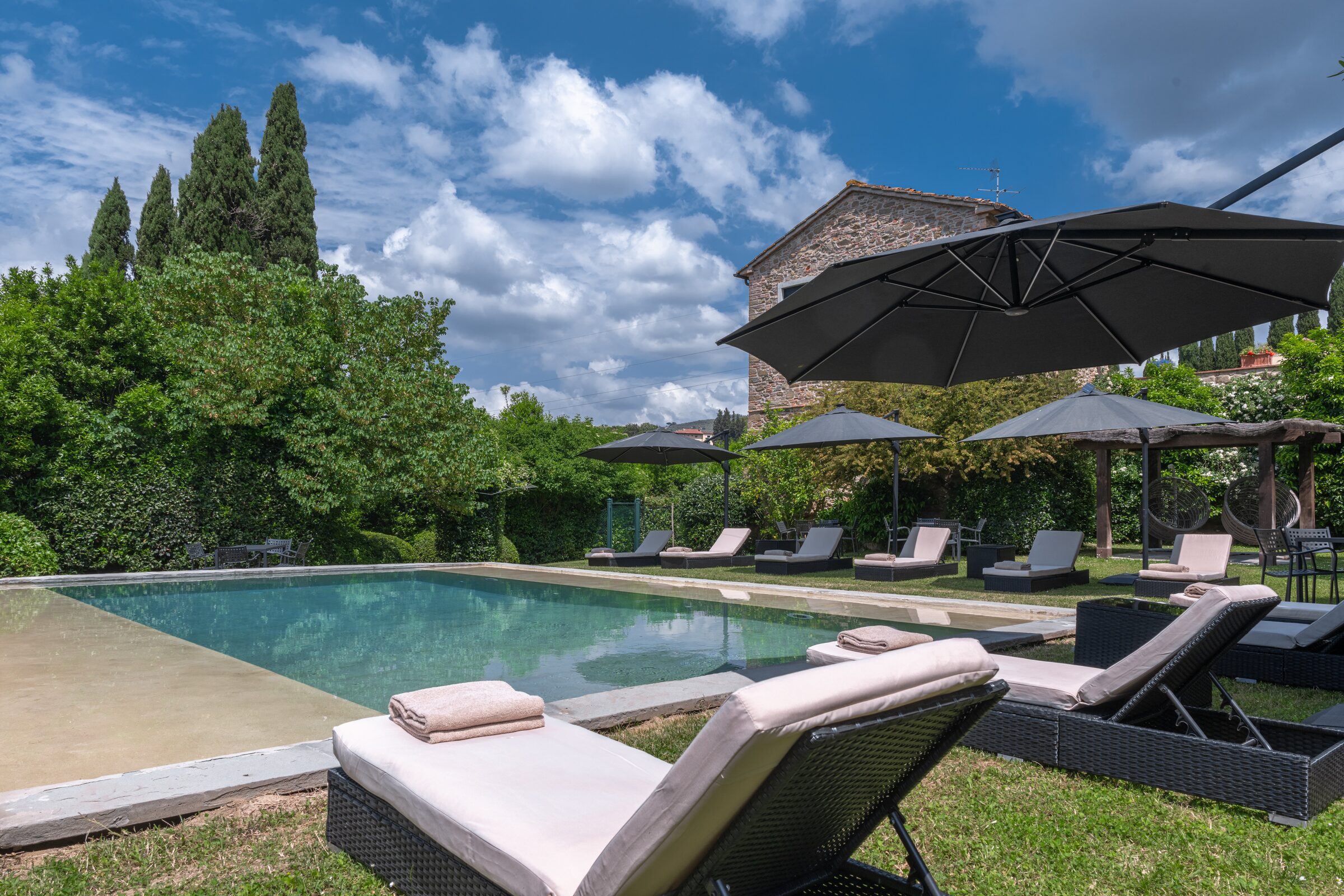 Pool with sun loungers
